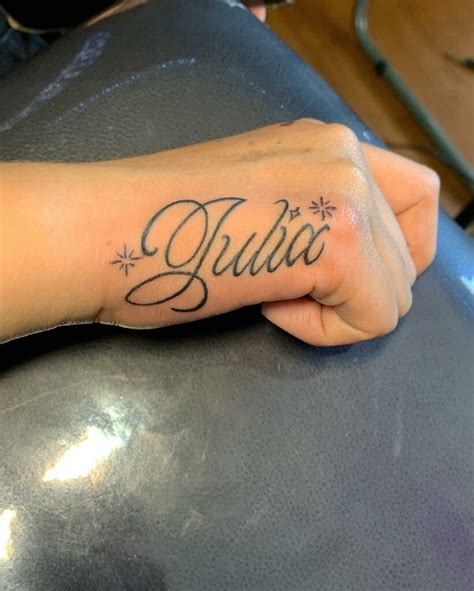 tattoos of names on hand